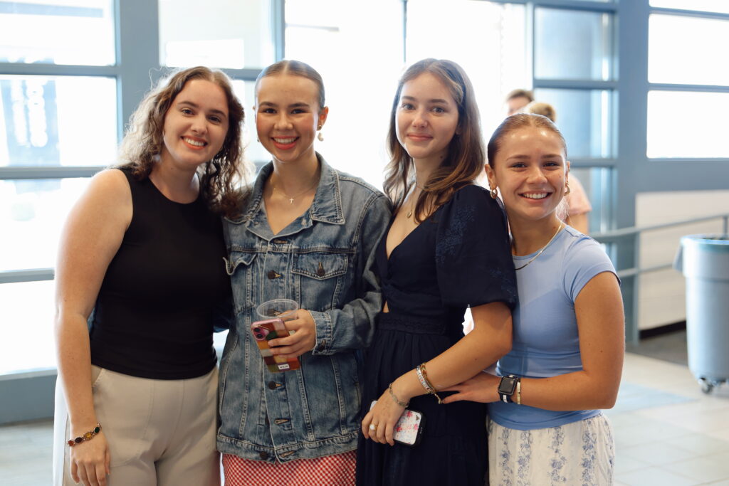 4 young women in lobby of Vintage Church